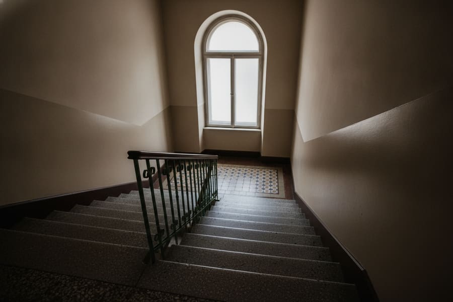 The entrance and stoop of a Brooklyn prewar walk-up apartment building